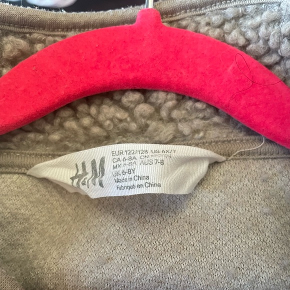 A warm unisex tan-ish brown pullover sweater with two front zipper pockets. - Picture 4 of 4